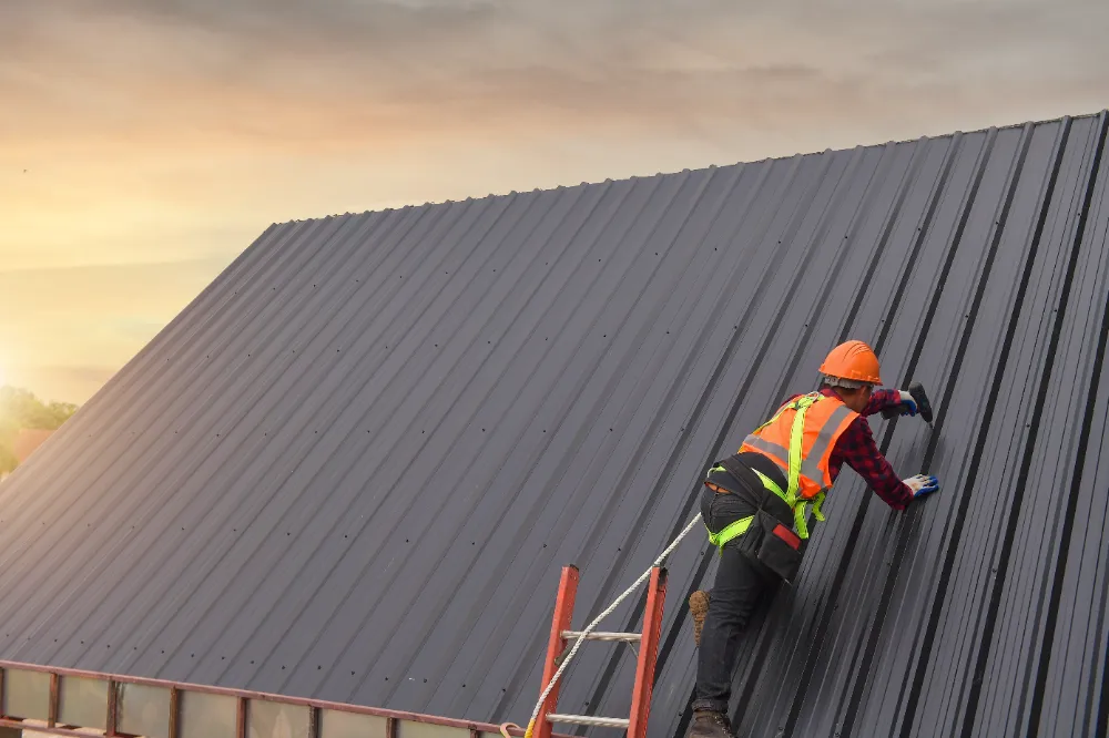 Metal roof installation worker in Bar Harbor Maine