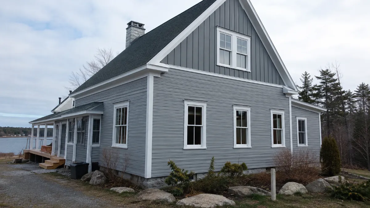 House with new deep navy custom siding and white trim